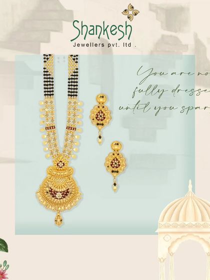You are not fully dressed until you sparkle. This mangalsutra set with matching earrings features a traditional design with red stone accents, offering timeless elegance.