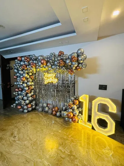 Another look at the stylish 16th birthday decor, capturing the reflection on the marble floor and the overall chic vibe.