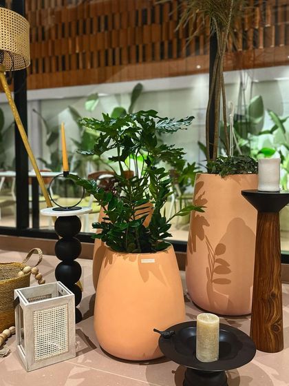 My peach-toned modern planters styled beautifully with candles and other decor at the new Concu outlet in Bengaluru.