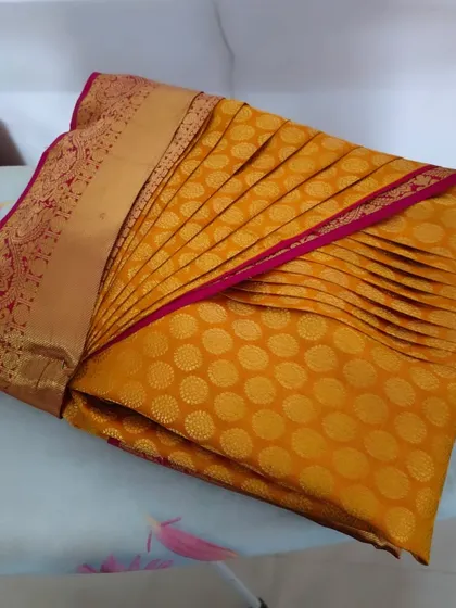 A perfectly pre-pleated and folded saree, ready to be worn. This is a great option for destination weddings or any event where you need to travel with your sarees.
