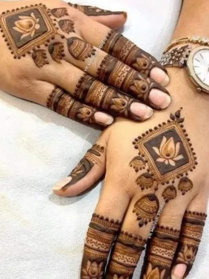 A modern take on traditional motifs, with a lotus enclosed in a square frame. This geometric style is perfect for someone who wants a unique and contemporary mehndi design.
