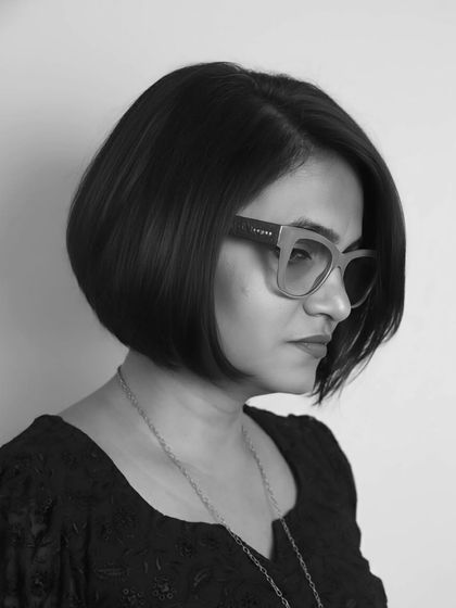A side profile of the monochrome bob, highlighting the perfect curve and clean line of the haircut.