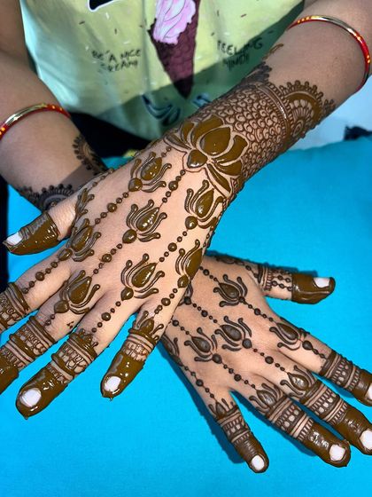 A close-up of the lotus trail design, showing the delicate beading and shading.