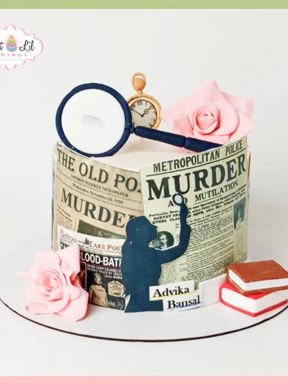 A cake for a detective in the making. This mystery-themed cake is wrapped in newspaper clippings about a murder and topped with a magnifying glass.