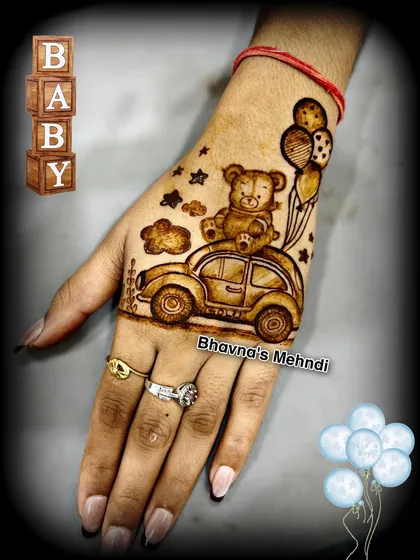 A super cute and unique design for a baby shower. This mehndi features a teddy bear sitting in a car with balloons, a sweet and playful way to celebrate the mom to be.