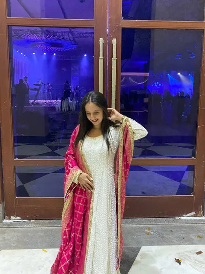 A candid moment from the Sangeet night, filled with colors, beats, and timeless grace.