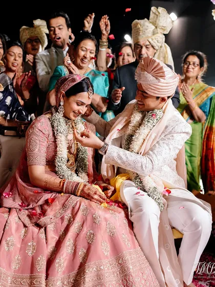 The joy is palpable as family and friends shower the couple with blessings and petals. We manage the flow of the event so these candid moments can unfold naturally.