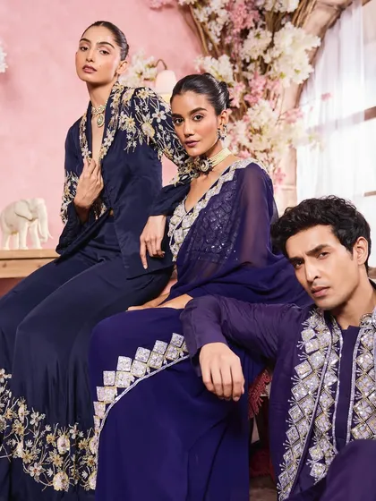 A group shot for a festive wear campaign, featuring both male and female models. I created coordinated looks for all three, ensuring the men's grooming was clean and the women's makeup was elegant.