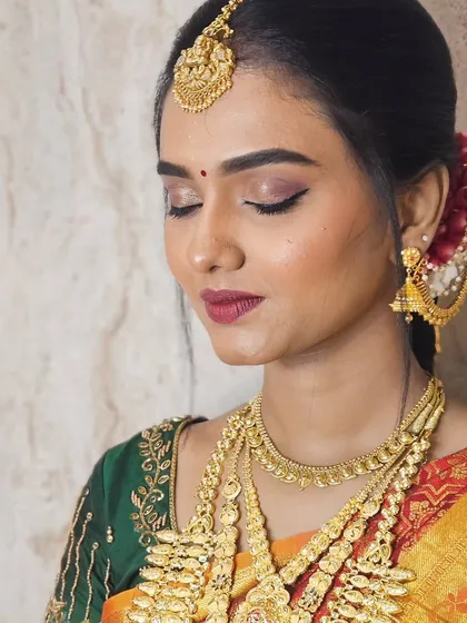 A close-up of Soundariya's muhurtham look, with her eyes closed, showing the soft and blended eyeshadow work.