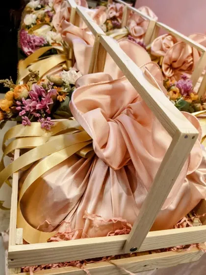 Another angle of the pinewood crate hampers for Hindustan Unilever, showcasing the elegant fabric wrapping and floral accents. This is a great example of sustainable yet beautiful corporate packaging.