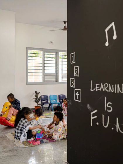 A glimpse into the activity zone, where learning and play merge. The blackboard wall is not just for lessons but for spontaneous creativity. This space was designed to be flexible, supporting the varied rhythms of a child's day, from focused learning to free play.