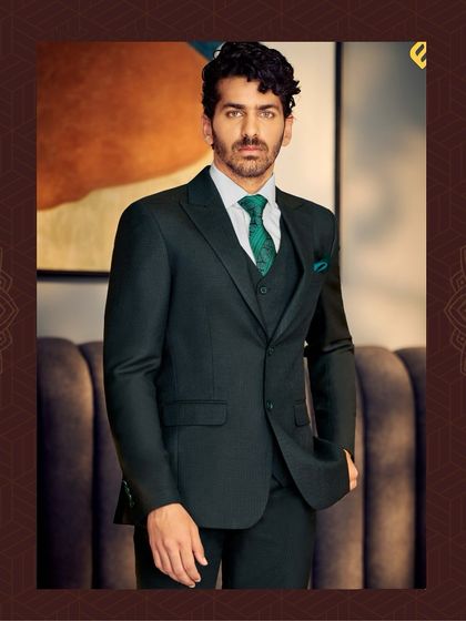 We create classic Italian silhouettes from the finest fabrics. This dark green three-piece suit is a perfect example of our commitment to quality and style.