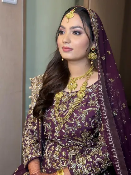 My bride Amena looking regal for her Walima. The deep purple and gold outfit was paired with a classic glam look featuring a smokey eye.