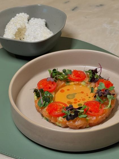 The ceviche served with sago crisps on the side, perfect for scooping up the delicious mix of salmon and avocado.