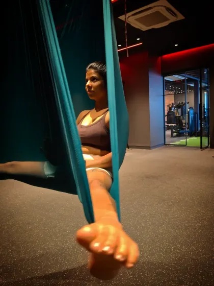 A seated pose in the aerial hammock. Even the simpler positions help to build core strength and improve your body awareness and balance.