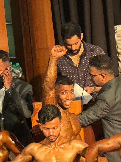 A moment of celebration on stage. The hard work pays off when you hear your number called.