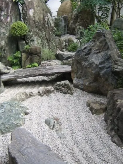 I create authentic Zen gardens that serve as a peaceful retreat. This project uses a combination of large natural stones, carefully raked gravel, and minimalist planting to build a space for quiet contemplation.