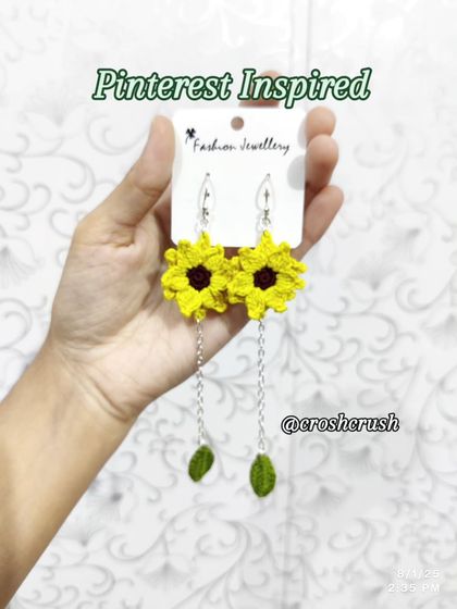 My popular dangling sunflower earrings. These feature a bright yellow sunflower top with a delicate chain leading to a small crocheted leaf.