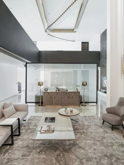 This image of the Silhouette project showcases the double-height living area and artistic touches that elevate the space, as highlighted in media features.