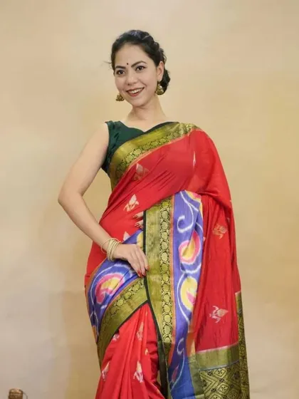 A vibrant red pre-stitched saree featuring a colorful Patola-inspired border. This piece is perfect for making a bold statement while enjoying the comfort and ease of my ready-to-wear design.