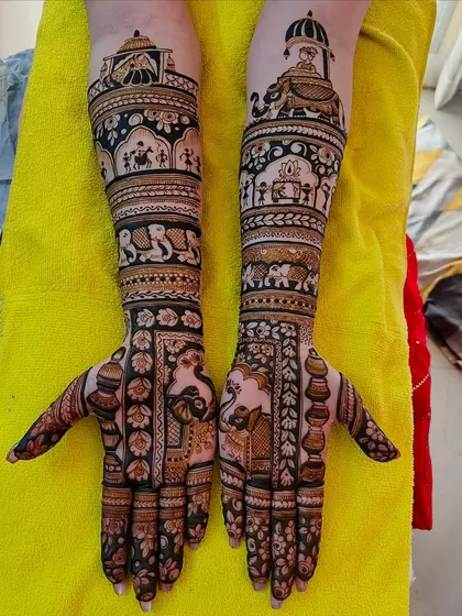 This design showcases a baraat procession with elephants and a doli. It's a popular choice for brides who want their mehndi to tell the story of their wedding day.