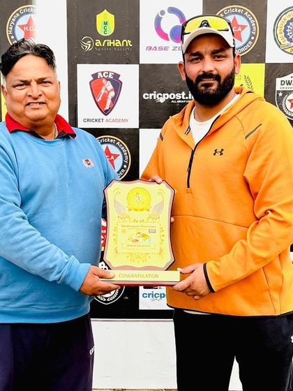 Receiving a memento at the 9th Bhagwan Parshuram Open Cricket Tournament.
