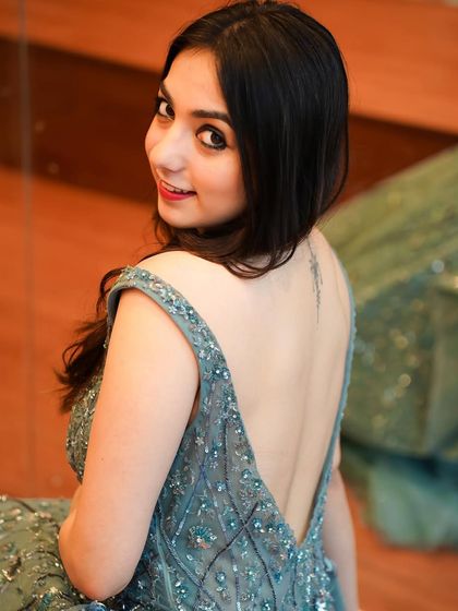 A close-up look at the back detail and tattoo in this elegant grey gown. It's all about capturing the small details that make an outfit special.