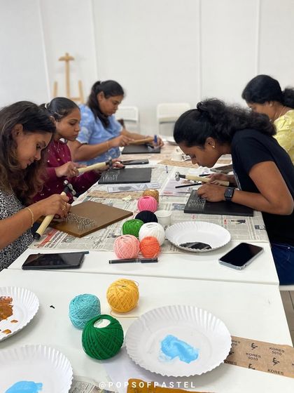 Participants focused on the intricate process of string art, a great activity for improving concentration and creativity.