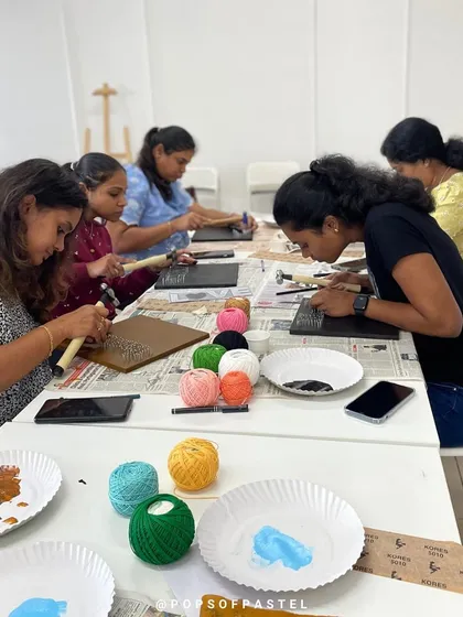 Participants focused on the intricate process of string art, a great activity for improving concentration and creativity.
