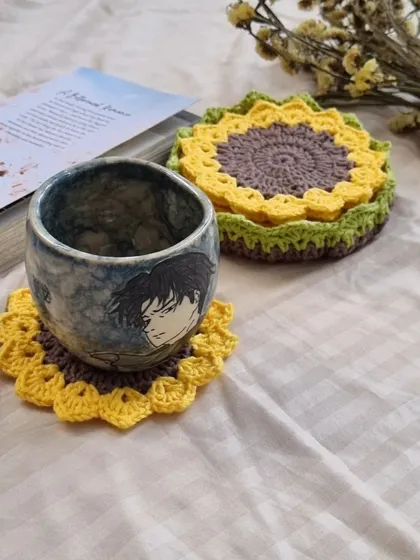 Make your morning coffee or evening chai a little more special. Our handmade sunflower crochet coaster set brings a little bit of sunshine to your tabletop.