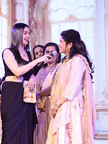 An interactive moment during a sangeet game. I make sure to connect with guests personally, making the entertainment feel inclusive and engaging.
