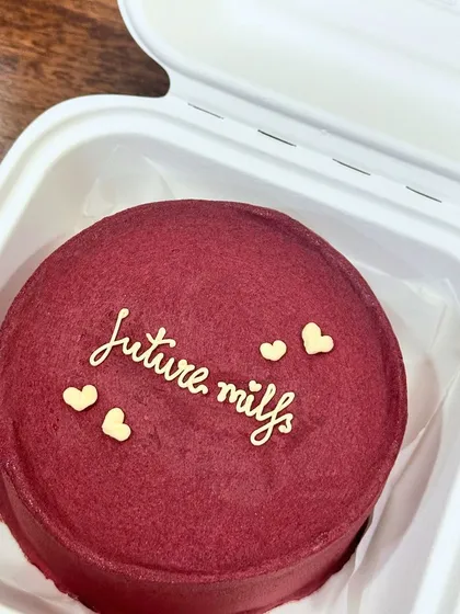 A bold red velvet bento cake with a cheeky 'future milfs' message. Perfect for a fun get-together with your best friends.