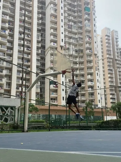 I lead by example on the court. This is me showing the kids what is possible with dedication. A dunk is not just about jumping, it is about power, timing, and practice.