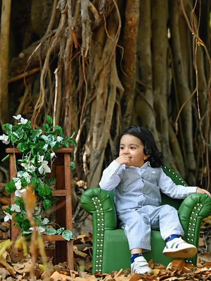 A thoughtful moment captured during the outdoor session, showing the child's natural curiosity.