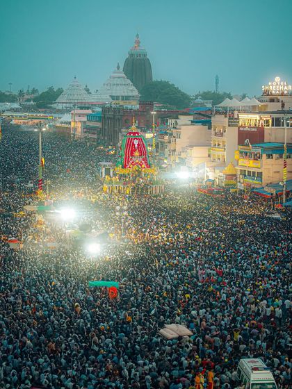 A breathtaking evening shot of the Rath Yatra, showing an estimated 1.5 million people gathered in Puri. The entire city is illuminated by lights and devotion.