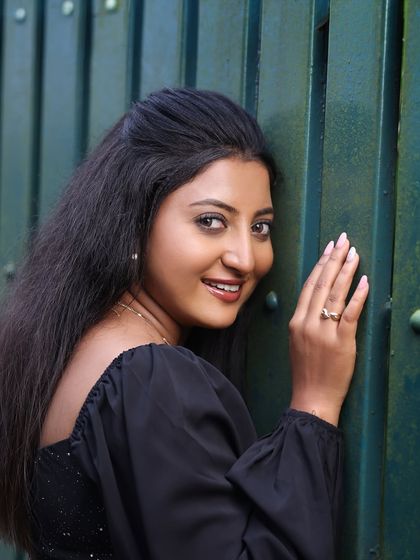 Studio and outdoor portraits of a model in a simple yet elegant black dress. This series focuses on capturing genuine expressions and personality, from joyful laughter to quiet contemplation.