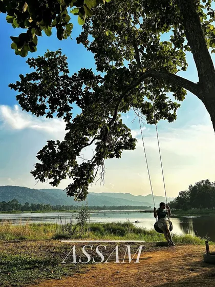 The peaceful riverside in Assam. We encourage travel that appreciates the quiet beauty and diverse landscapes of our country.
