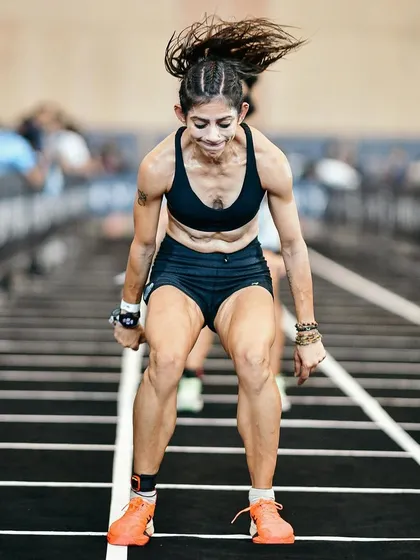 Burpee broad jumps are brutal, especially deep into a race. This shot captures the explosive effort required for every single rep. My coaching emphasizes building the stamina to maintain power even when you're fatigued.