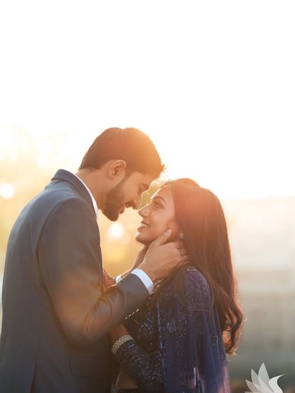 A breathtaking silhouette shot of the couple against the sunset. This artistic photo captures the romance of the moment perfectly.