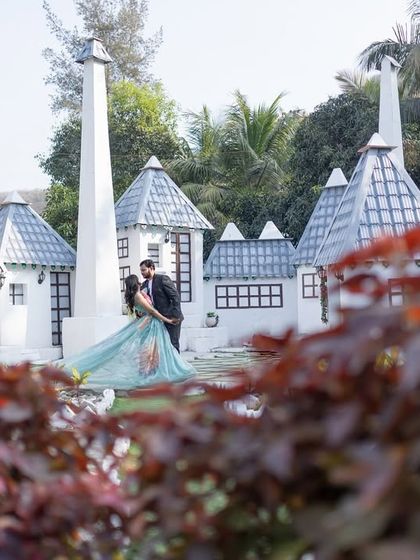 A fairytale-like shot with a miniature castle backdrop. This unique set allows for creative and whimsical pre-wedding photography.