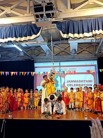 The 'Dahi Handi' ceremony is a highlight of our Janmashtami celebrations. This image captures the excitement and teamwork as students recreate the playful antics of Lord Krishna, cheered on by their peers and teachers.