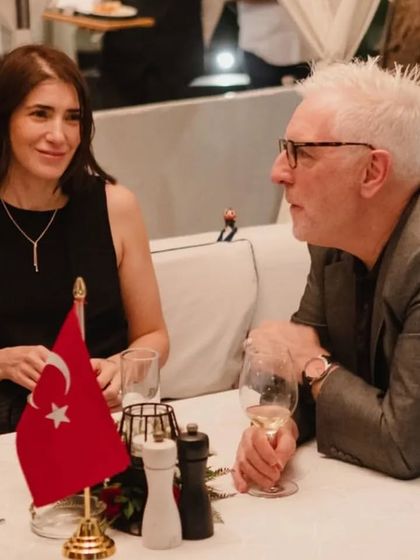 Guests enjoying an intimate conversation during a diplomatic dinner. The ambiance is perfect for both personal and professional gatherings.