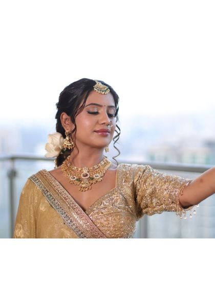 A serene moment captured. With her eyes closed, you can see the soft, blended eyeshadow and the overall peaceful radiance of her bridal makeup.