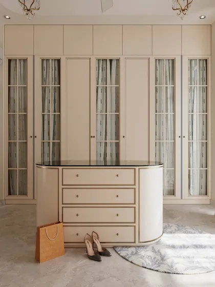 The full view of the wardrobe wall and central island, demonstrating how we create luxurious and highly functional personal spaces.