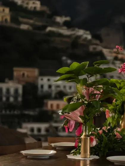 A table with a view of the Amalfi coast mural, a nod to my past and the inspiration behind the dream that is Roxie.
