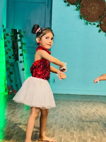A close-up of one of our young performers during a video shoot. Her focus and expression are already so professional.