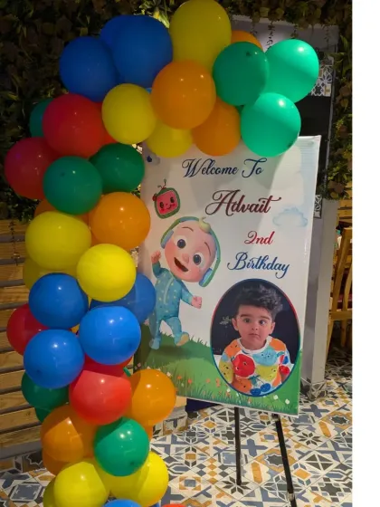 I also create welcome signs to match the theme. This personalized Cocomelon welcome board is a great way to greet guests at the entrance.