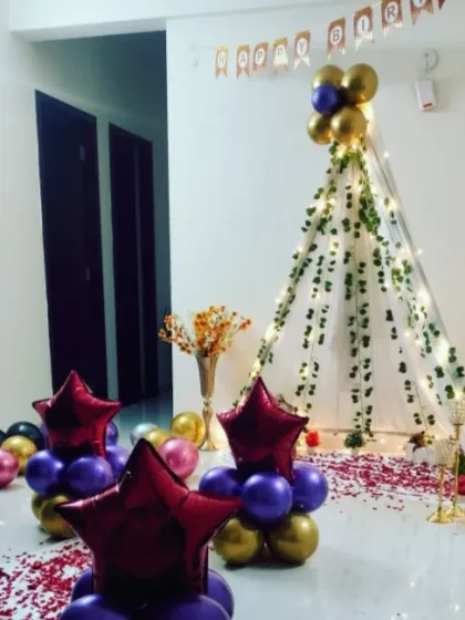 An angled view of the teepee party, showing the path of rose petals leading into the tent.