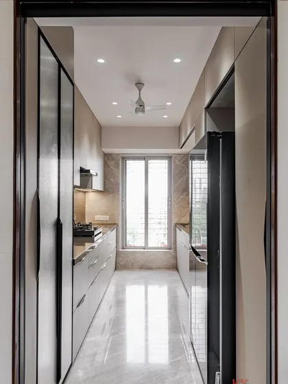 A view from the entrance of the Kandivali parallel kitchen, showing the long, efficient layout.