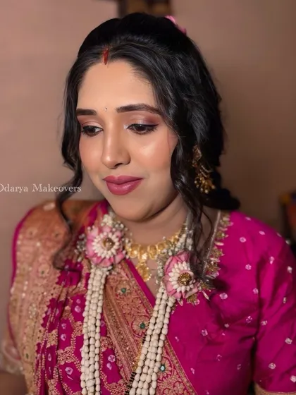 Another angle of this lovely baby shower look. The makeup is designed to enhance her natural pregnancy glow.